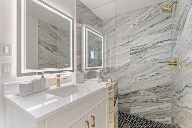 bathroom with vanity and tiled shower