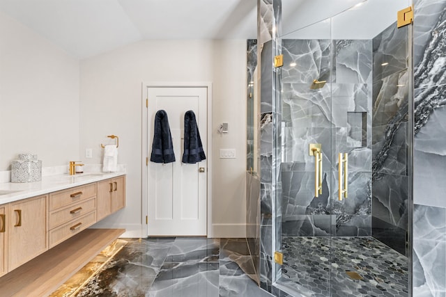 bathroom with walk in shower, lofted ceiling, and vanity