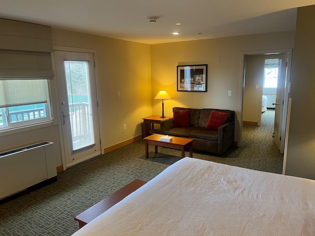 carpeted bedroom featuring access to outside