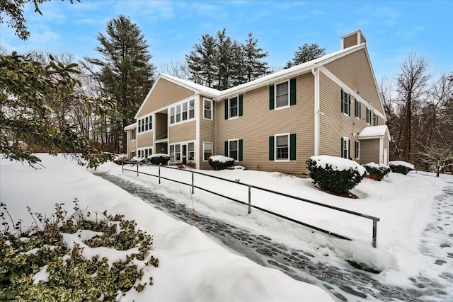 view of snow covered house