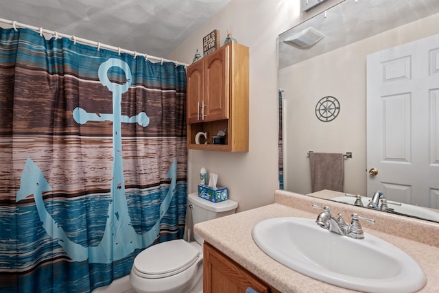 bathroom featuring vanity, a shower with shower curtain, and toilet