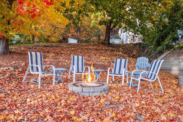 view of yard with an outdoor fire pit