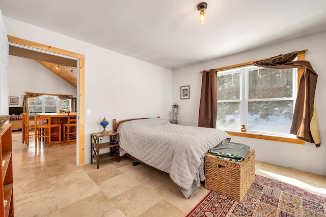 bedroom with lofted ceiling