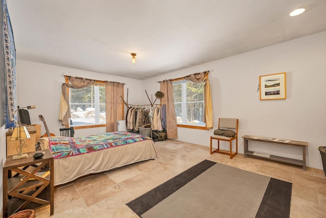 bedroom featuring multiple windows