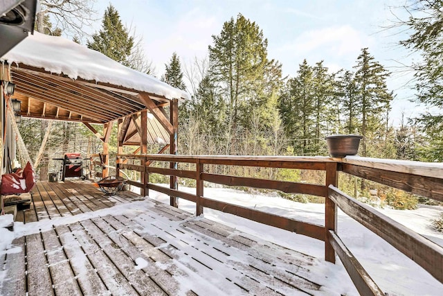 wooden deck with a fire pit