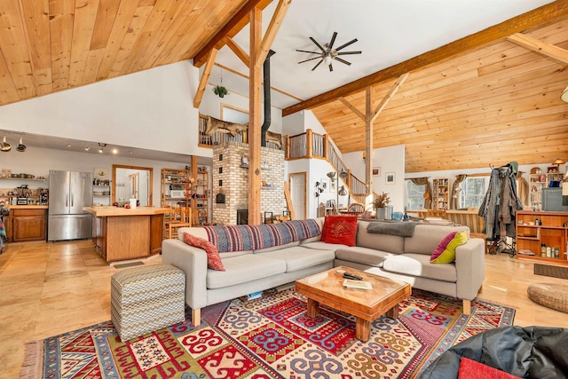 living room featuring ceiling fan, wood ceiling, high vaulted ceiling, and beamed ceiling