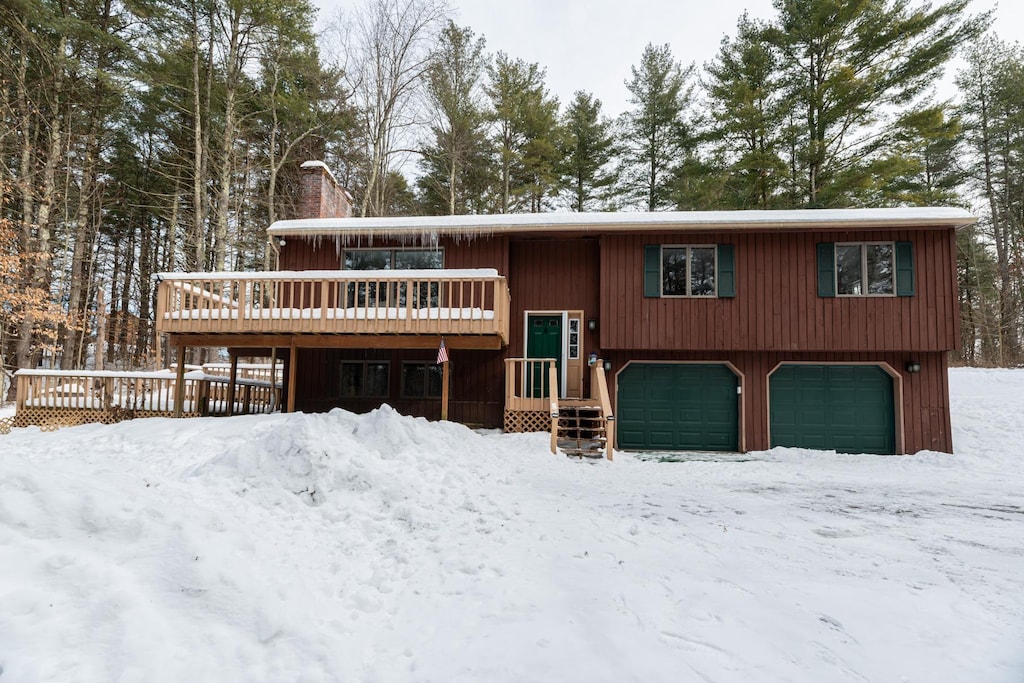 raised ranch with a garage and a deck