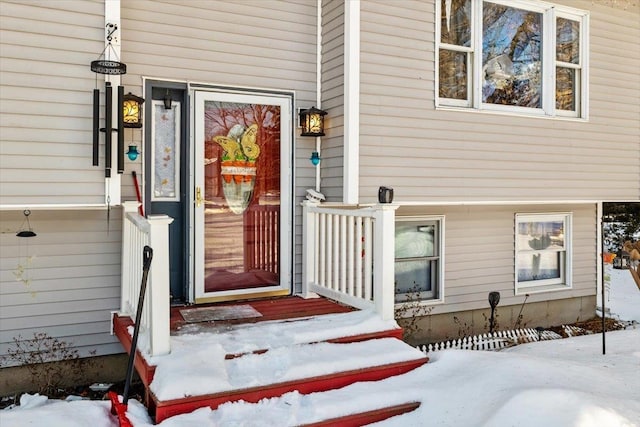 view of snow covered property entrance