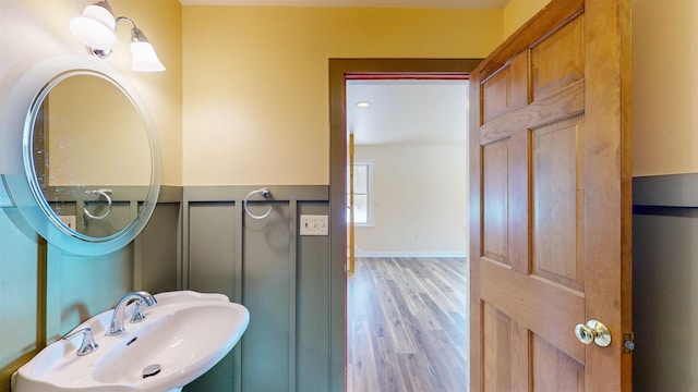 bathroom featuring hardwood / wood-style flooring and sink