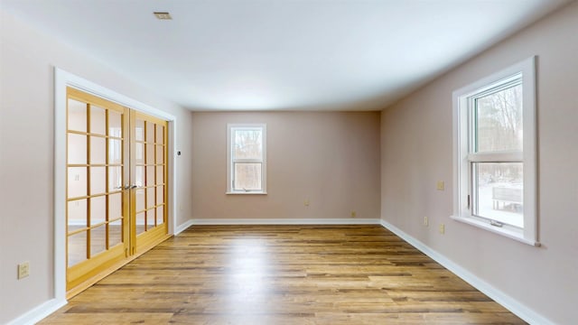 unfurnished room featuring light wood-type flooring