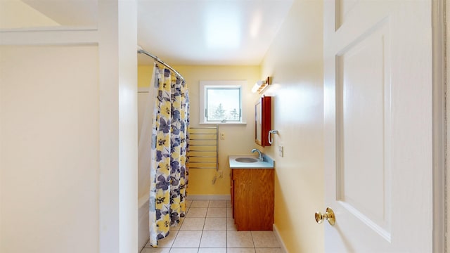 bathroom featuring vanity, tile patterned floors, and shower / bath combination with curtain