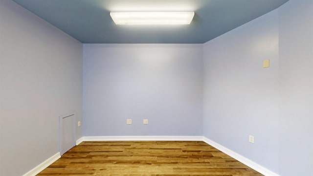 spare room featuring hardwood / wood-style floors