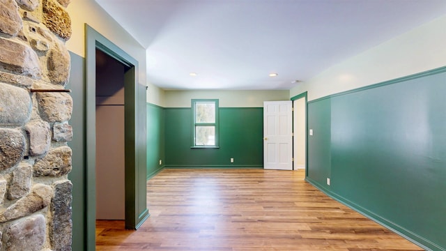 spare room with light hardwood / wood-style flooring