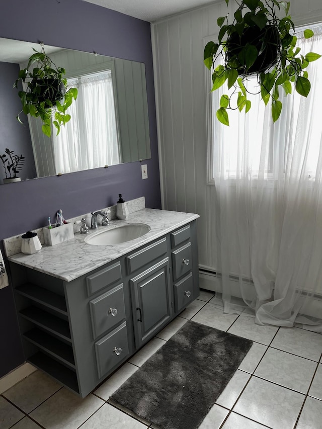 bathroom with tile patterned flooring and vanity