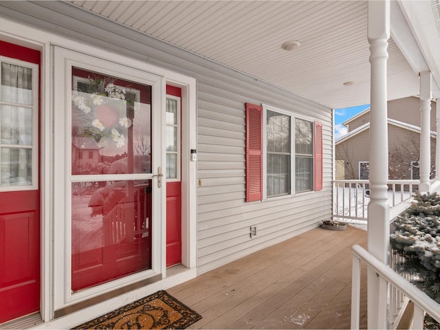 entrance to property featuring a porch