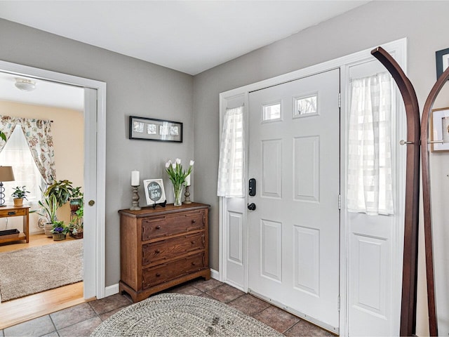 foyer with light tile patterned floors