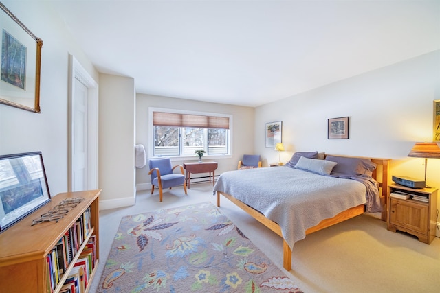 carpeted bedroom with baseboard heating