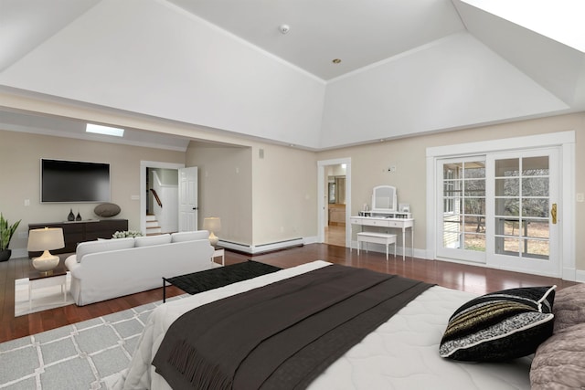 bedroom featuring hardwood / wood-style flooring, a baseboard radiator, and high vaulted ceiling