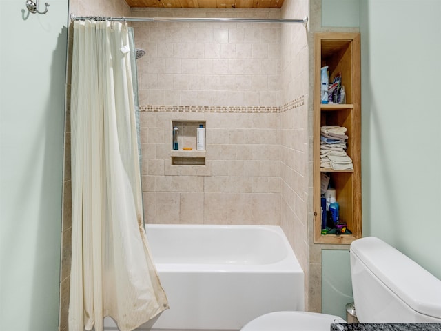 bathroom with shower / tub combo with curtain and toilet