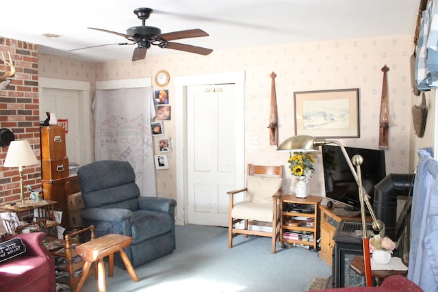 carpeted living room with ceiling fan