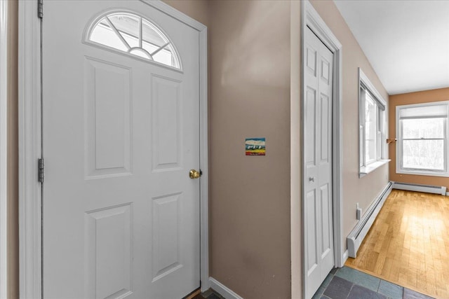 entrance foyer featuring hardwood / wood-style flooring and baseboard heating