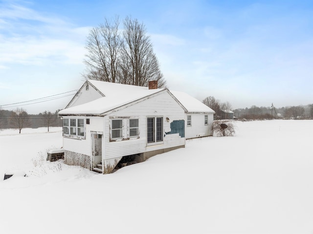 view of snow covered house