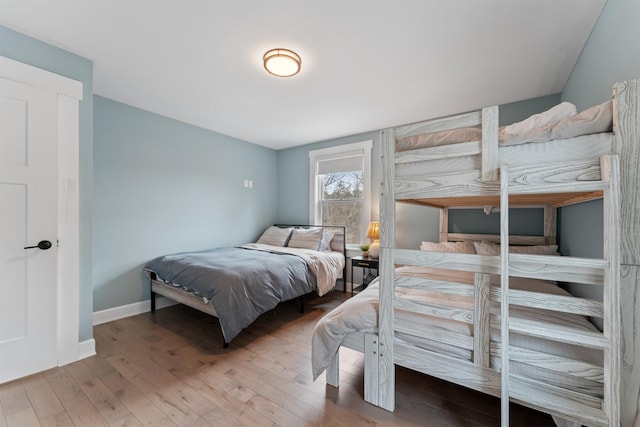 bedroom with hardwood / wood-style floors