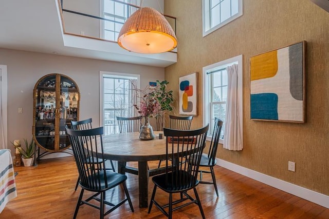 dining area with wood-type flooring