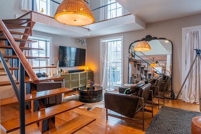 living area with plenty of natural light and wood-type flooring