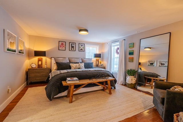 bedroom with hardwood / wood-style floors