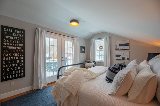 bedroom with wood-type flooring, french doors, and lofted ceiling