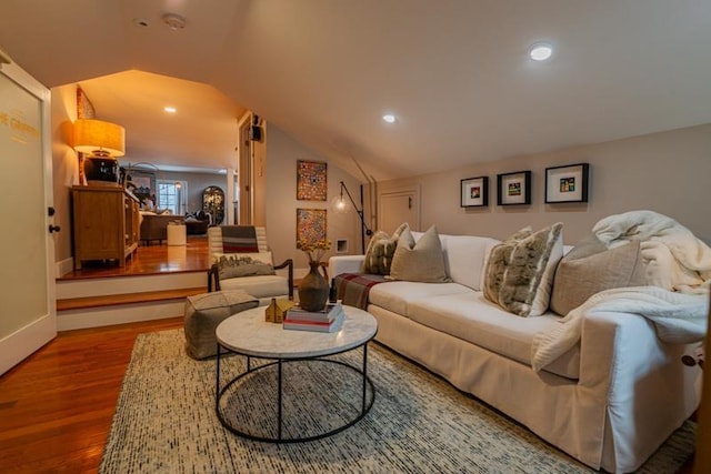 living room featuring hardwood / wood-style flooring and lofted ceiling