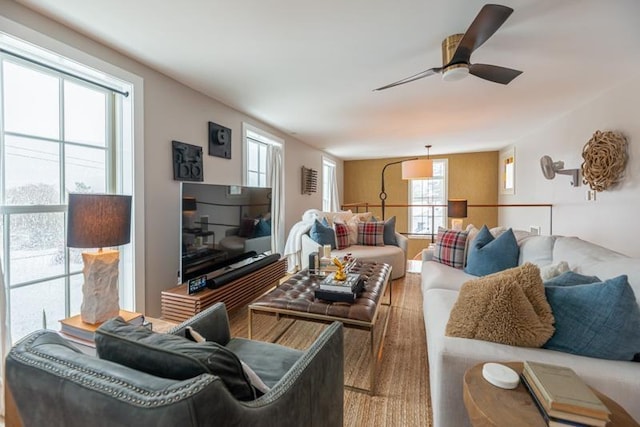 living room with hardwood / wood-style floors and ceiling fan