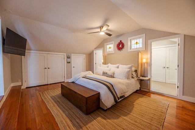 bedroom with hardwood / wood-style flooring, ceiling fan, and vaulted ceiling