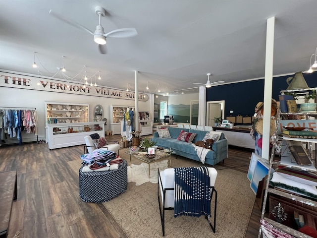 living room with ceiling fan and wood-type flooring