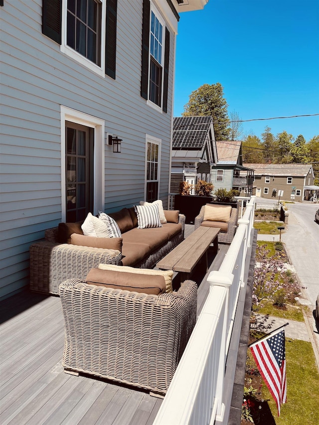 wooden deck featuring an outdoor hangout area