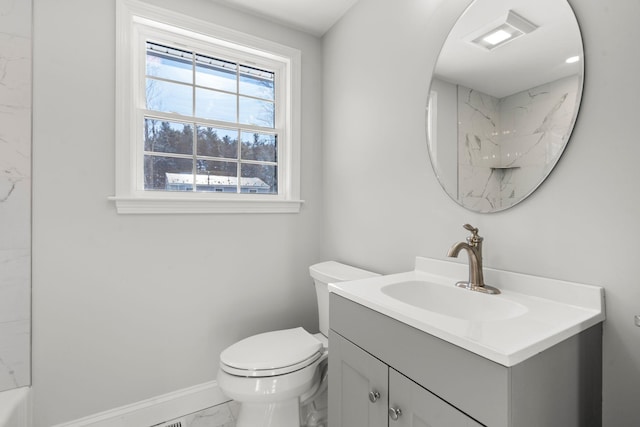 bathroom featuring vanity and toilet