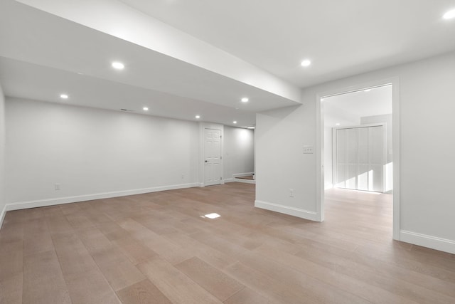 basement featuring light hardwood / wood-style flooring