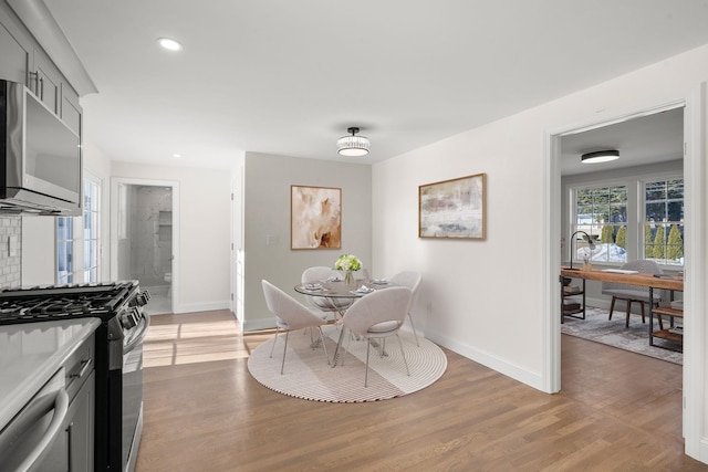 dining area with light hardwood / wood-style flooring