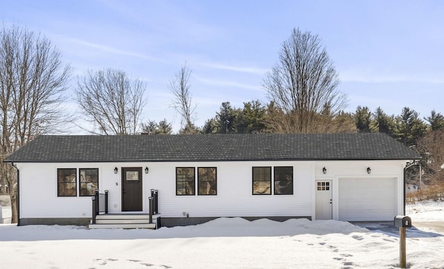 ranch-style home featuring a garage