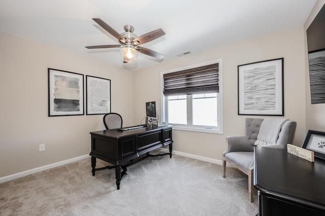 office featuring ceiling fan and light colored carpet