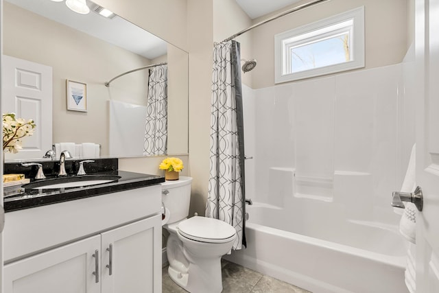 full bathroom featuring toilet, shower / bath combo with shower curtain, and vanity