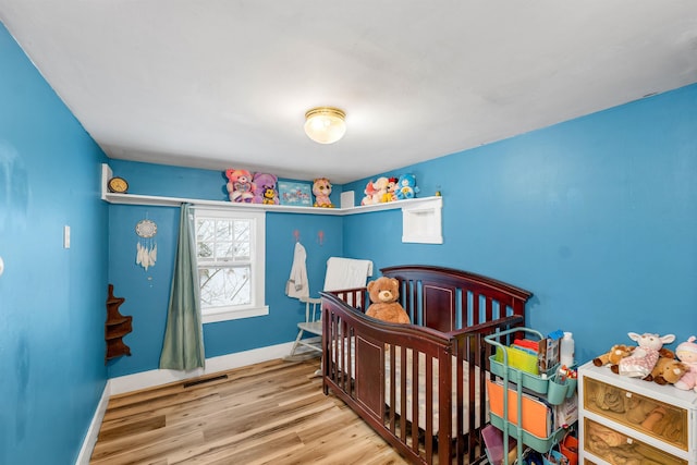 bedroom with light hardwood / wood-style flooring