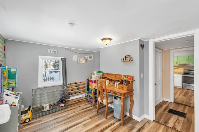 dining space with light hardwood / wood-style flooring