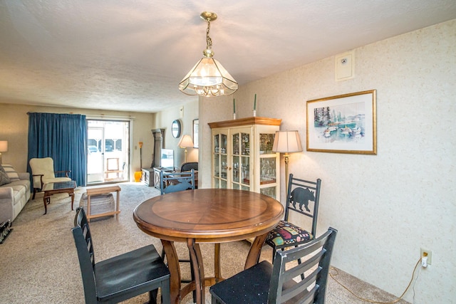 dining room featuring carpet floors