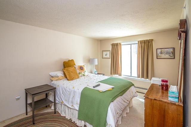 bedroom with a baseboard radiator, light carpet, and a textured ceiling