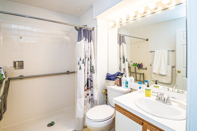 bathroom featuring toilet, a shower with curtain, and vanity