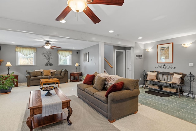 carpeted living room featuring ceiling fan