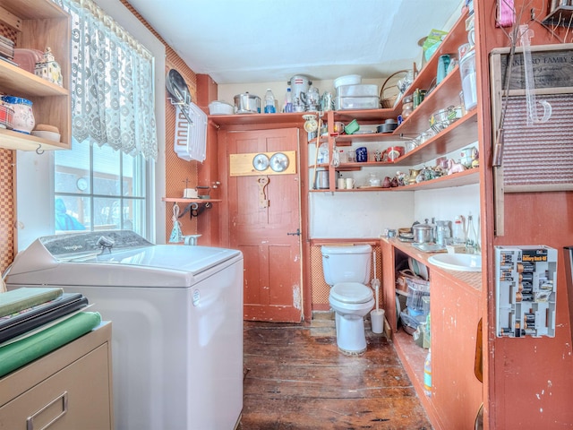 laundry room featuring independent washer and dryer and dark hardwood / wood-style floors