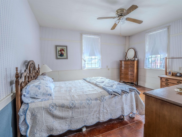 bedroom with ceiling fan and wood-type flooring